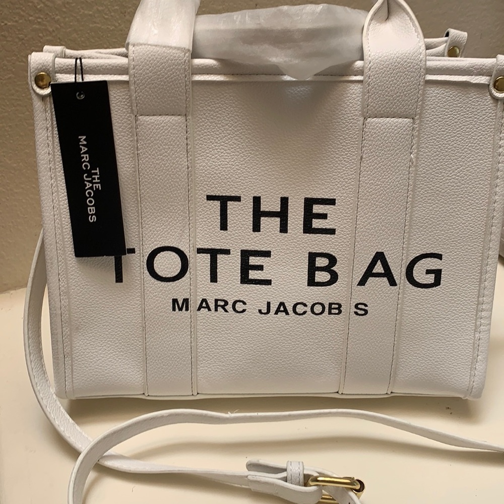Brand new with tags the Marc Jacobs tote bag and an off-white in color